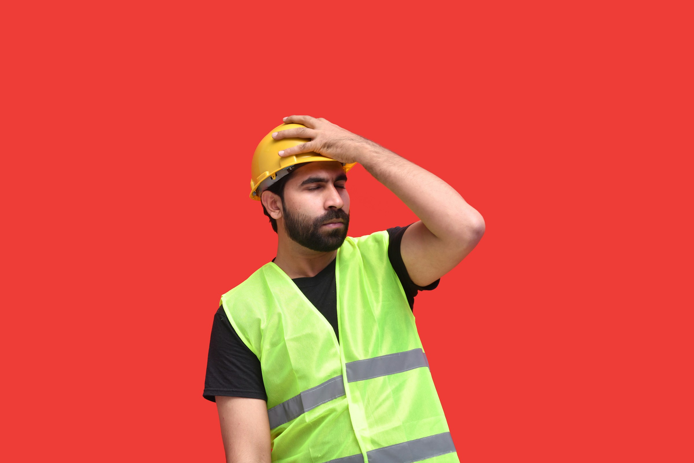 contractor holding his head